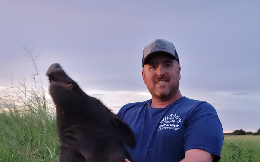 Bill Wilson with a wild hog removed in Manatee County