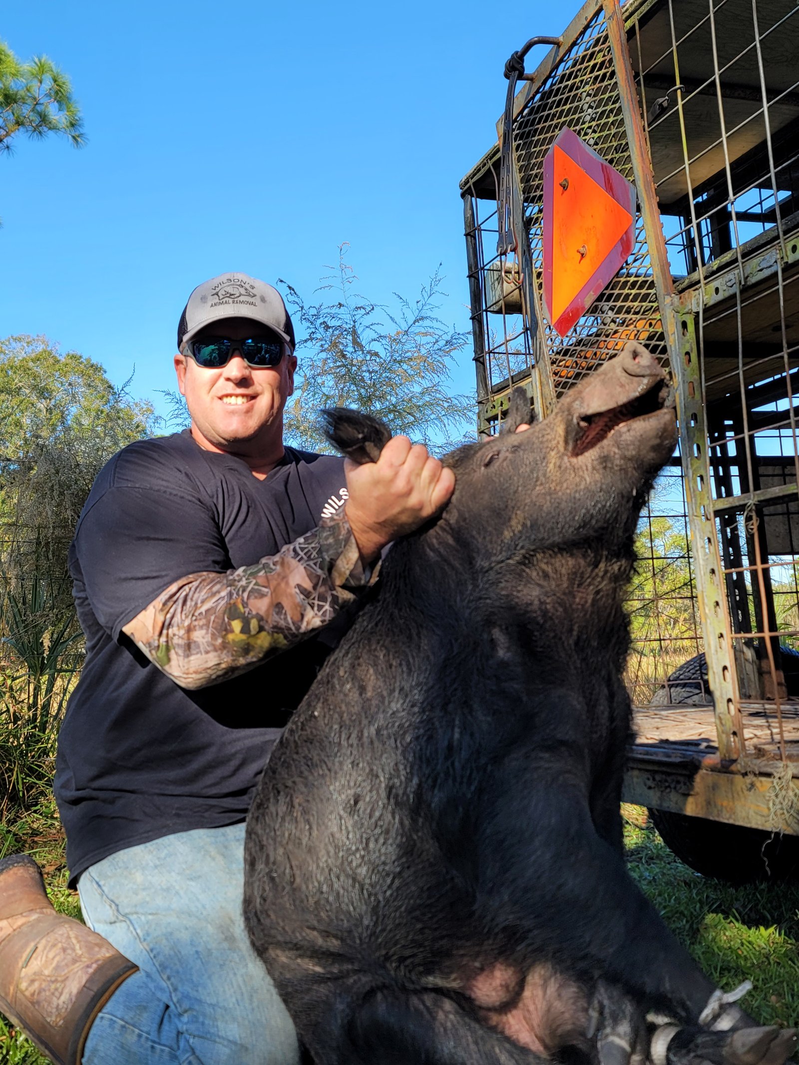 Bill Wilson with a large wild hog